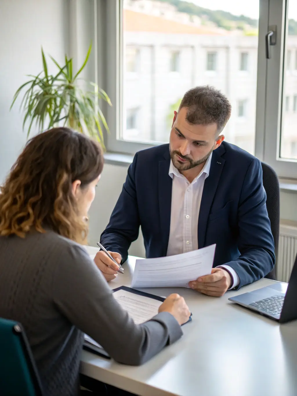 A professional photo of a consultant conducting an initial consultation with a client, discussing their hiring needs and company culture.